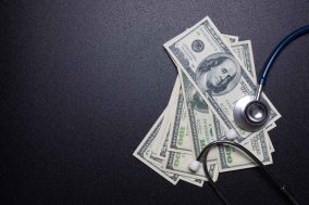 Stethoscope on dollar banknotes